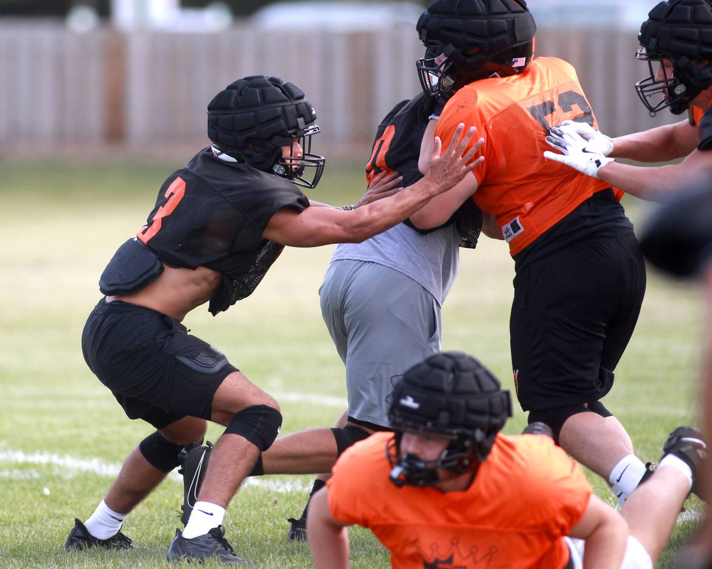 St. Charles East linebacker Luke Herrera (left) blocks a play during a practice on Thursday, Aug. 22, 2024 in St. Charles.