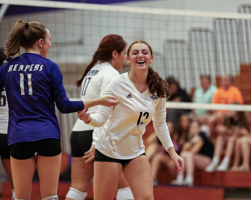 Plano's Emily Santolin (12) celebrates a point during volleyball match between Sandwich at Plano.  August 21, 2023.