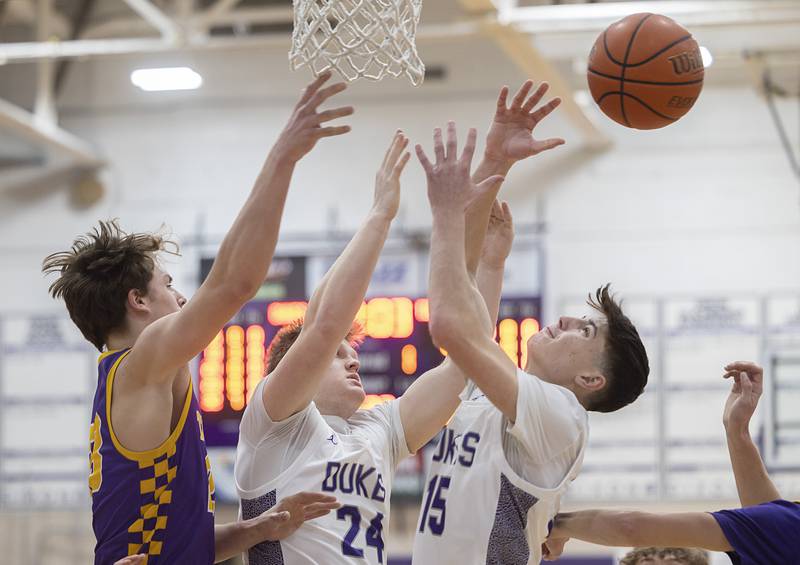 The ball skips over Sherrard’s Holland Anderson (left), Dixon’s Eli Davidson and teammate Alex Harrison Thursday, Feb. 15, 2024 at Dixon High School.