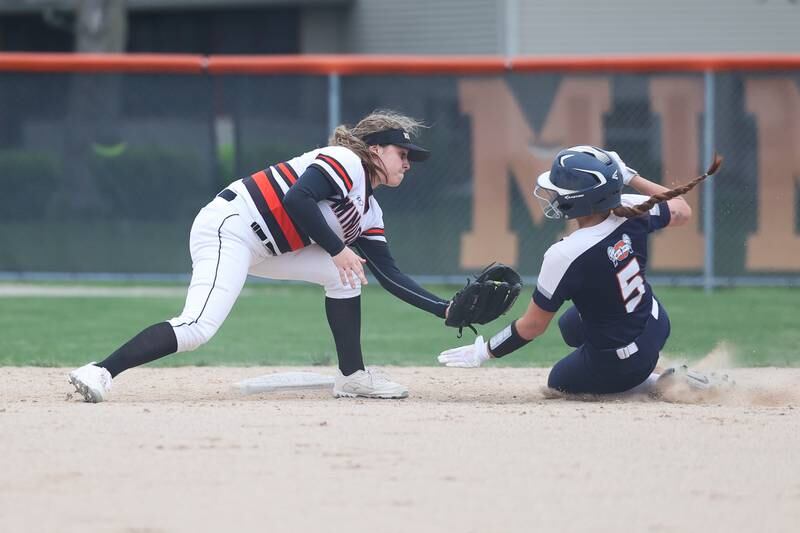 Minooka’s Karli McMillin puts the tag on Oswego’s Marissa Moffett on Wednesday, April 17, 2024 in Minooka.