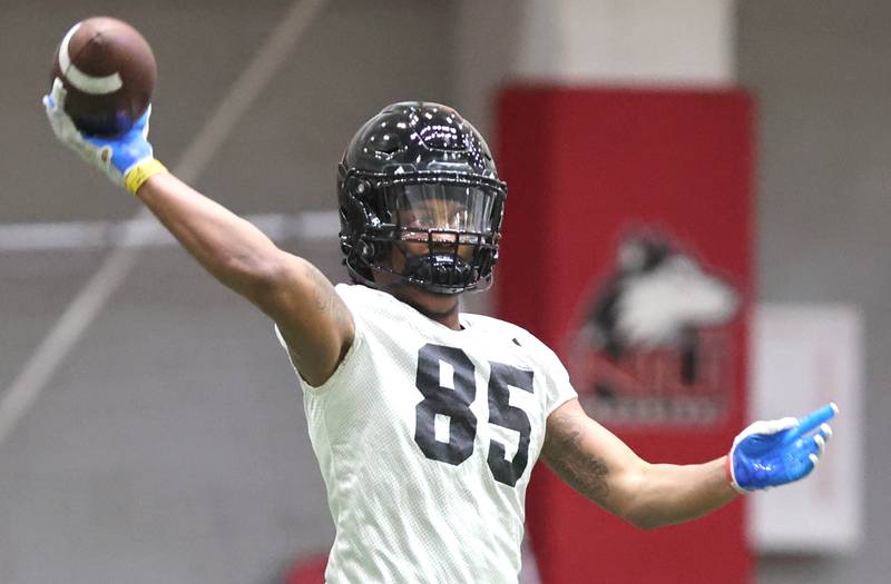 Northern Illinois receiver Trayvon Rudolph throws the ball during the teams first spring practice Wednesday, March 22, 2023, in the Chessick Practice Center at Northern Illinois University in DeKalb.