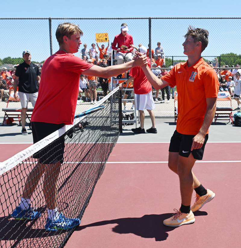 Hersey’s Mitch Sheldon, right, shakes hands with Hinsdale Central’s Alex Kotarski after winning the Class 2A singles championship at the boys state tennis tournament at Palatine High School on Saturday, May 25, 2024 in Palatine.