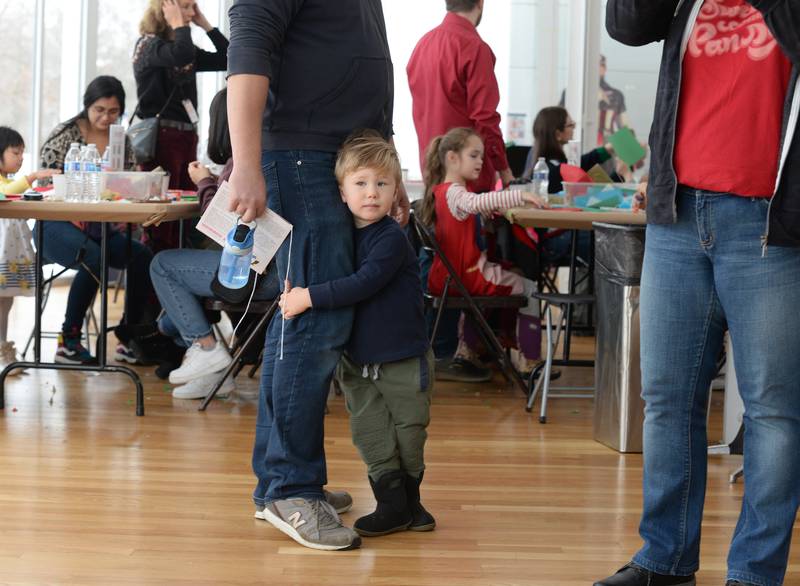 Gustav Skoczylas of Elmhurst hesitates to see Santa while attending the Family Holiday Party at the Art Museum Saturday Dec 17, 2022.