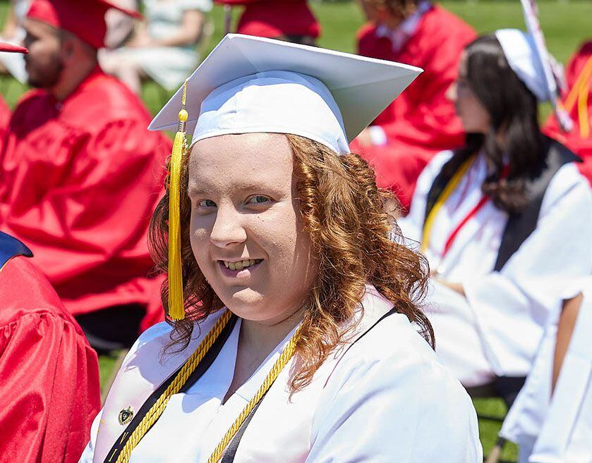 Hall High School senior Sara Beier smiles during the graduation ceremony on Sunday, May 21, 2023, outdoors at the high school. 