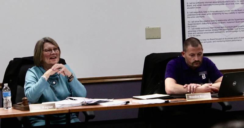 Dixon Public Schools board president Linda Wegner and board secretary Brandon Rogers participate in a discussion during a regular session meeting on April 19, 2023.