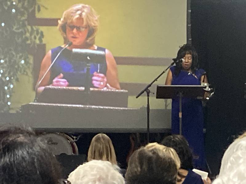 Zonta Joliet President Bonnie Winfrey speaks at the 50th Anniversary celebration.Zonta Joliet President Bonnie Winfrey speaks at the 50th Anniversary celebration on Oct. 19, 2023. Sue Bornhofen with the Jacob Henry Mansion, a former Zonta member, is featured during a slide show presentation.