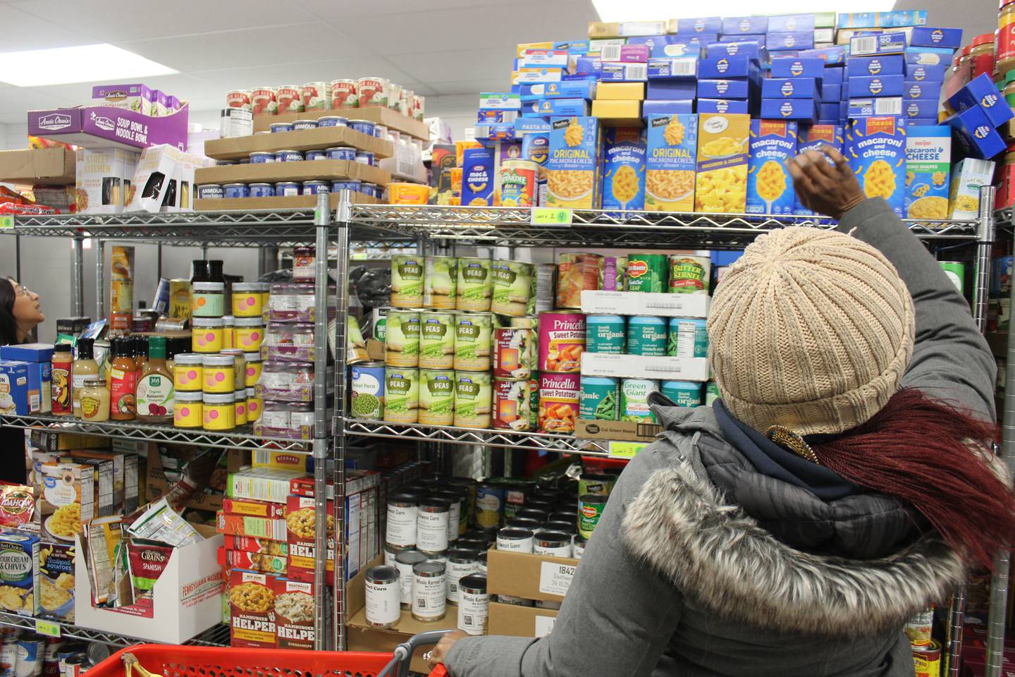 A client picks out nonperishables at the District 300 Food Pantry.