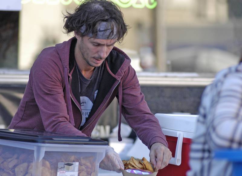 Danny Eddy of  LIL Smoke in Dixon, serves chips at the fest. The Dement Town Music Fest, presented by Discover Dixon was held on Saturday, Sept. 7, 2024