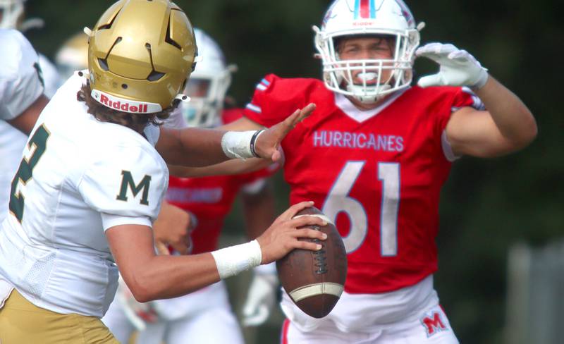 Marian Central’s Justin Jakubowicz pressures Bishop McNamara’s quarterback in varsity football action on Saturday, Sept. 14, 2024, at George Harding Field on the campus of Marian Central High School in Woodstock.