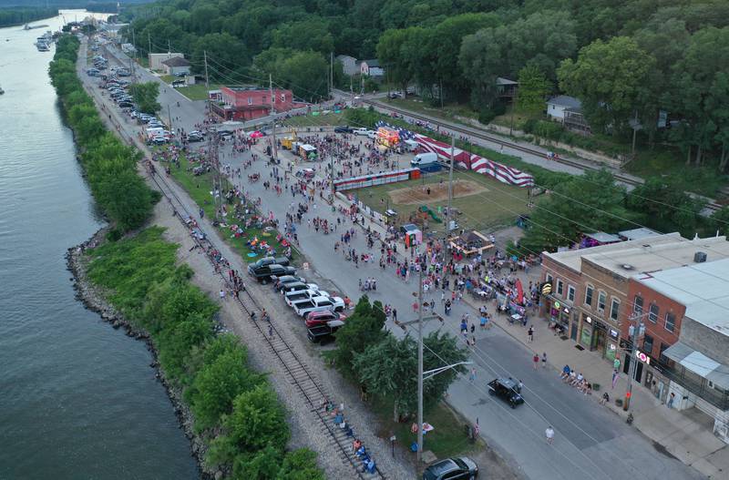 A large crowd gathers along Water Street an hour before the  fireworks on Wednesday, July 3, 2024 in Peru.
