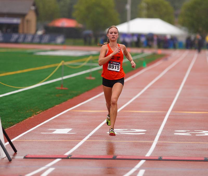 Wheaton Warrenville South’s Nicole Poglitsch crosses the finish line first with a time of 17:31.9 during the DuKane Conference Cross Country Championship at Lake Park High School in Roselle on Saturday, Oct. 14, 2023.