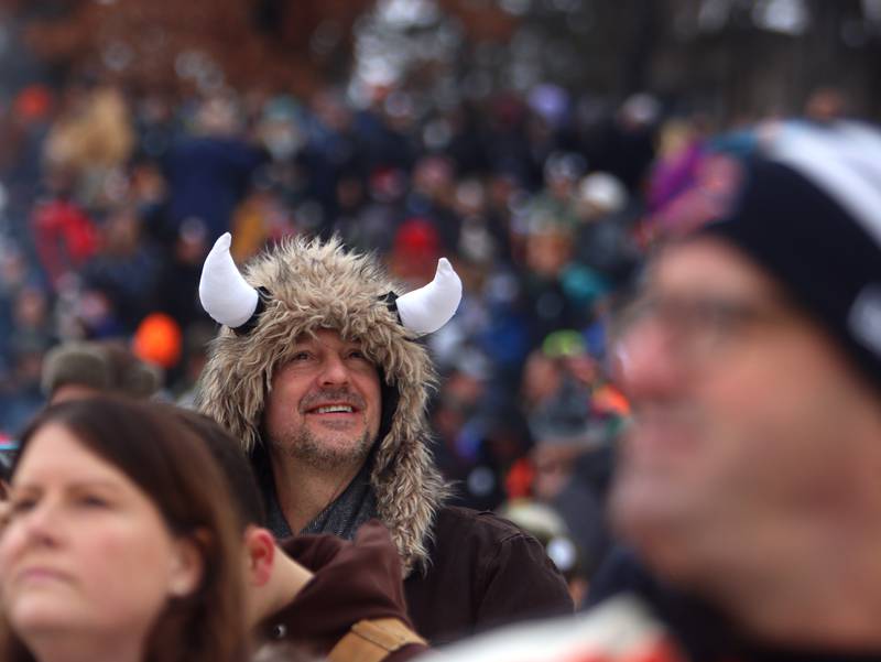 Cory Sligting of McHenry and others wait for ski jumpers during the 119th Norge Annual Winter Ski Jump Tournament in Fox River Grove Sunday.