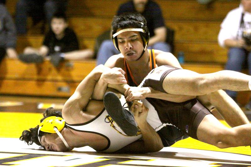 Jacobs’ Mike Haro, bottom, battles Crystal Lake Central’s Greco Rendon at 126 pounds in varsity wrestling Thursday at Algonquin.