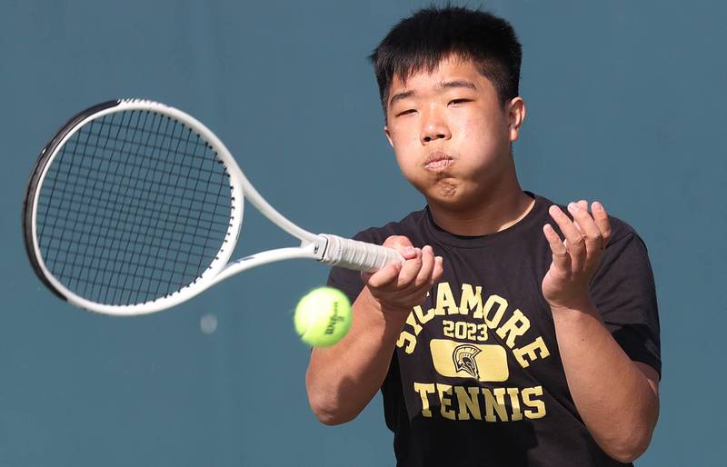 Sycamore number two singles player Regan Ni hits a forehand Wednesday, April 26, 2023, during their match against DeKalb at Sycamore High School.