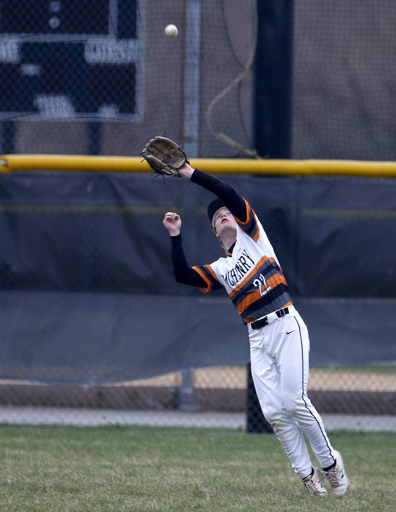 McHenry’s Richard Powell III catches a fly ball hit by Jacobs’s Christian Graves during a Fox Valley Conference baseball game Friday, April 15, 2022, between Jacobs and McHenry at Petersen Park in McHenry.