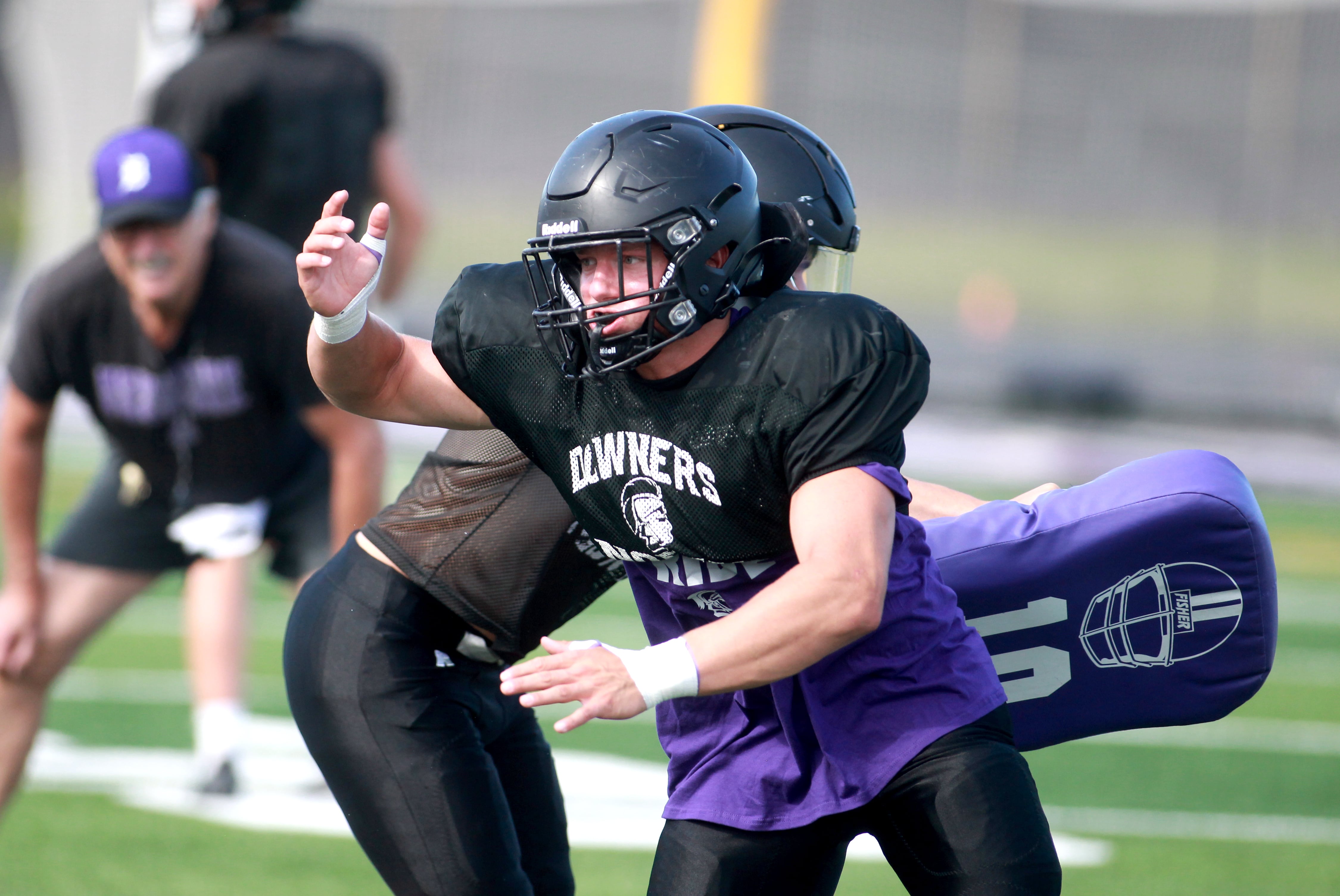 Downers Grove North’s Jake Gregorio works out with the linemen during a practice on Tuesday, Aug. 20, 2024 at the school.