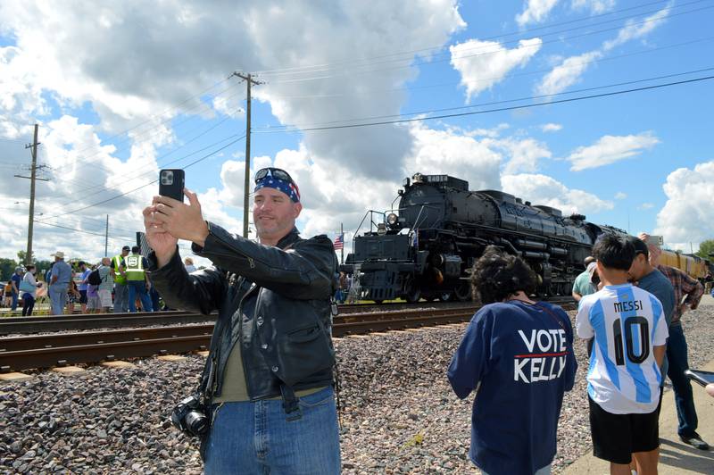 Matt Kasput, of Chicago, takes a selfie in front of the Union Pacific Big Boy Steam Engine No. 4014 during its whistle stop on Friday, Sept. 6, 2024, at the Sterling Marketplace.