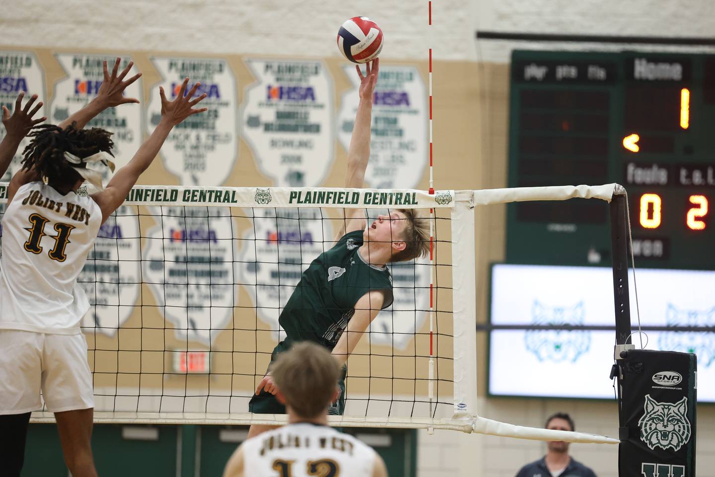 Plainfield Central’s Milo Nelson stretches for the shot against Joliet West on Tuesday, April 23, 2024 in Plainfield.