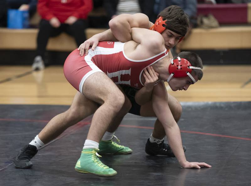 Crystal Lake Central's Dillon Carlson wrestles with Huntley's Alex Limoncello during the 160 pound bout on Thursday, January 27, 2022 at Huntley High School.