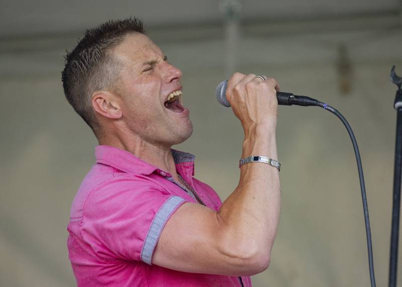 Abbynormal lead singer Wes Schmidt performs the song "Smooth" on Sunday, May 26, 2024, for the audience at the Music and Arts Festival at Pulaski Park in La Salle.