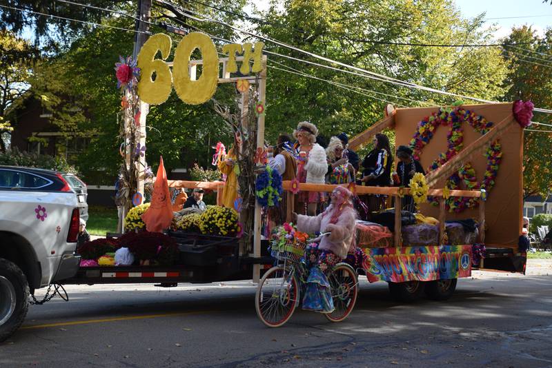 The 2021 Sycamore Pumpkin Festival Parade's "Crowd Pleaser" award was given to the float named "Groovy Groupies Rockin' into the 60th."