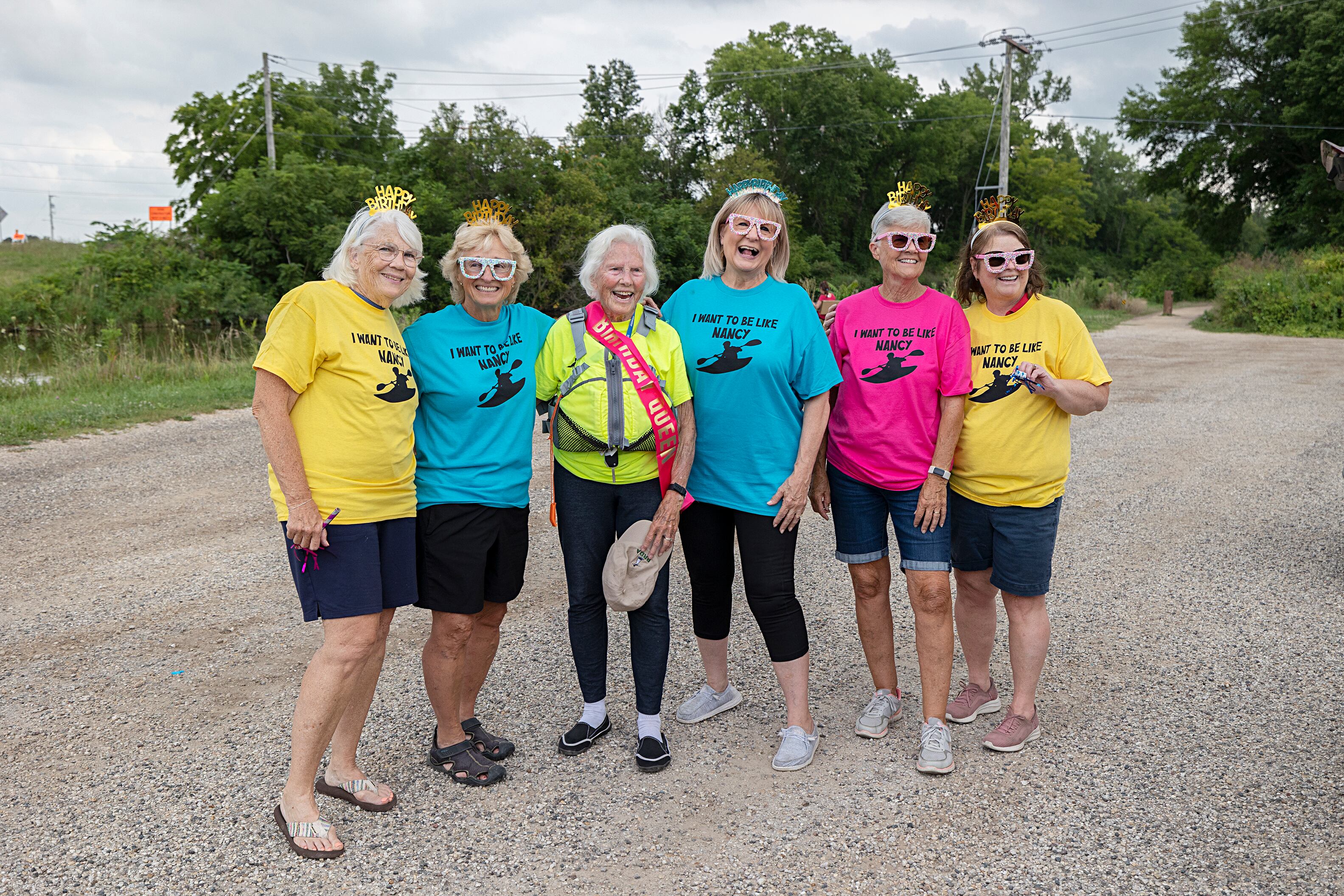 Gail Jeanblanc (left), Karen Miles, Nancy Gates, Teri Jahn, Jan Dallam and Carolyn Hohenboken line up for a photo Wednesday, July 24, 2024. The Yak-Yak Sisters had shirts made that read “I Want to be Like Nancy” to celebrate their friend for her birthday.