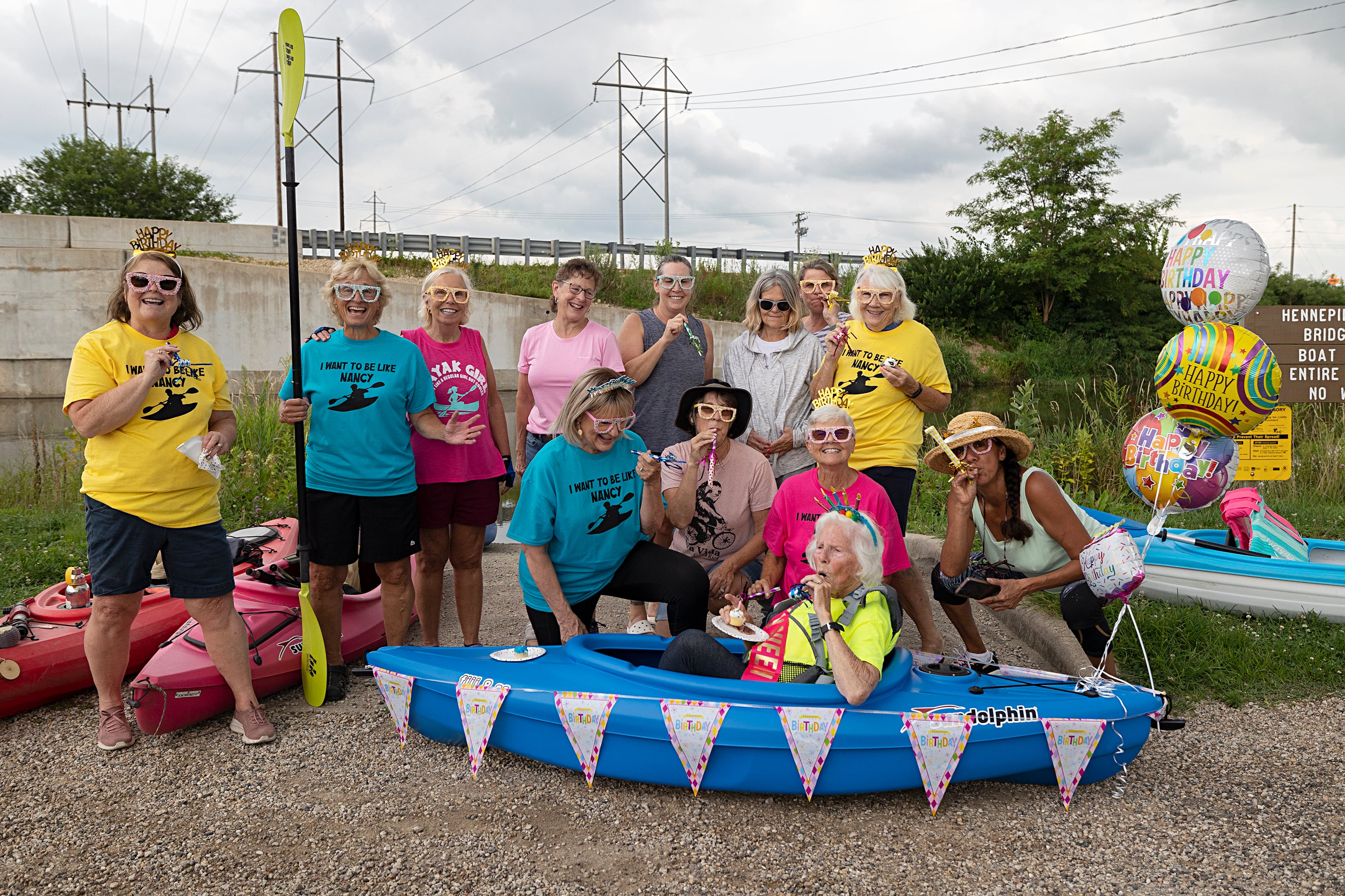 The Sisters gather around Nancy for a picture before the float Wednesday, July 24, 2024.