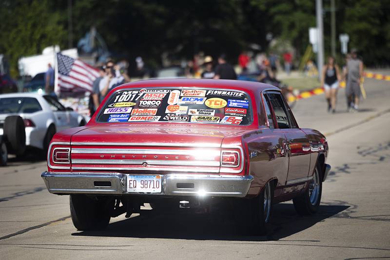 Drag racers roll into Rock Falls on Monday, June 10, 2024, to stop over between races in Byron and Cordova. Organized by Motion Raceworks' Sick the Magazine, nearly 350 of the high-powered street-legal rides stopped in the downtown for a block party.