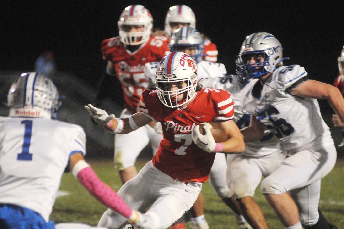 Ottawa's Dillan Quatrano (7) jukes Woodstock's Caden Monti at King Field on Friday, Oct. 21, 2022.