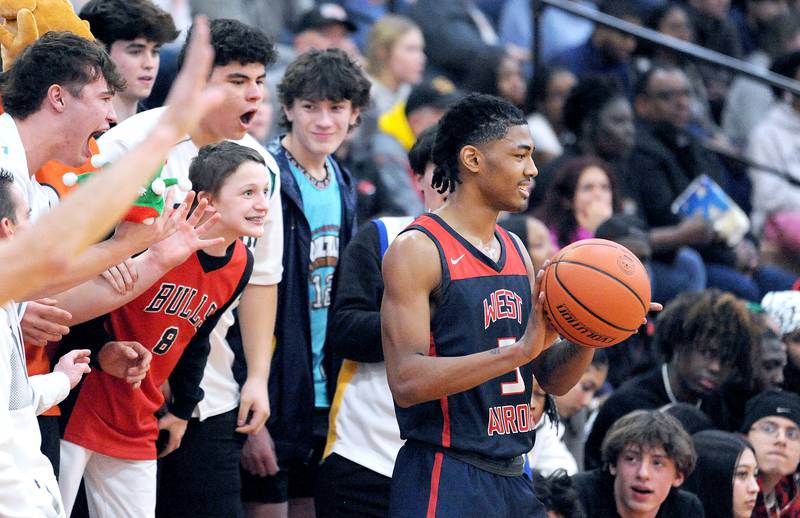 West Aurora's Terrence Smith gets an earful from the Yorkville fans during a class 4A regional semifinal basketball game at Yorkville High School on Wednesday, Feb. 21, 2024.