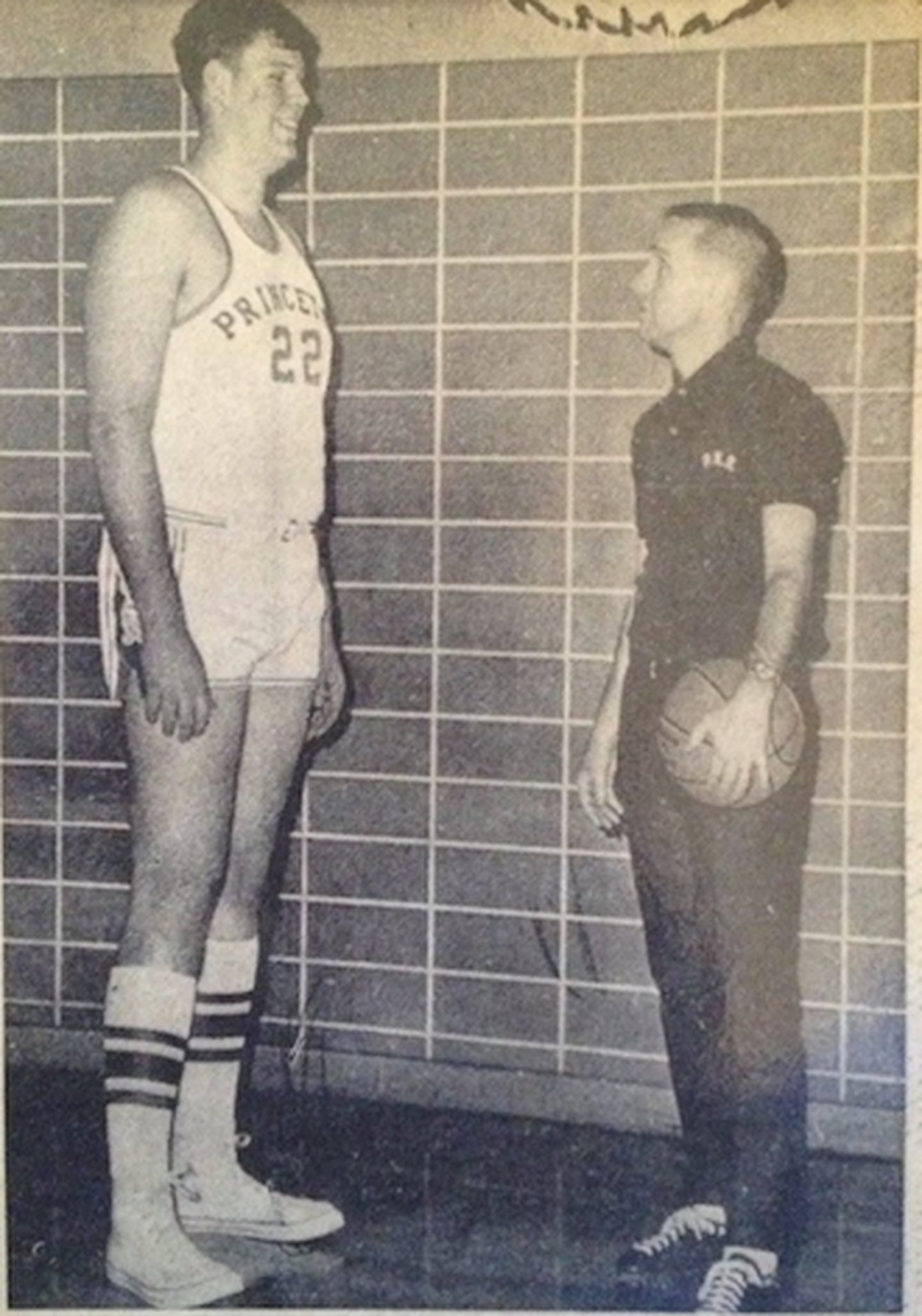 Former Princeton basketball coach Don Holler looks up at his 7-foot-1 center Rick Larson during the 1968-69 season at Prouty Gym.