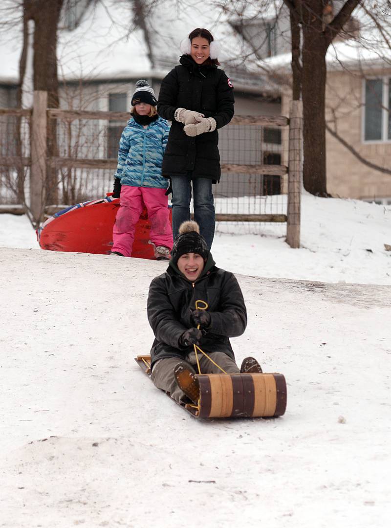 Children and adults including Kullen Healy of Lagrange Park enjoy sledding at Memorial Park in Lagrange Park despite the cold temperatures Saturday, Jan 13, 2024.