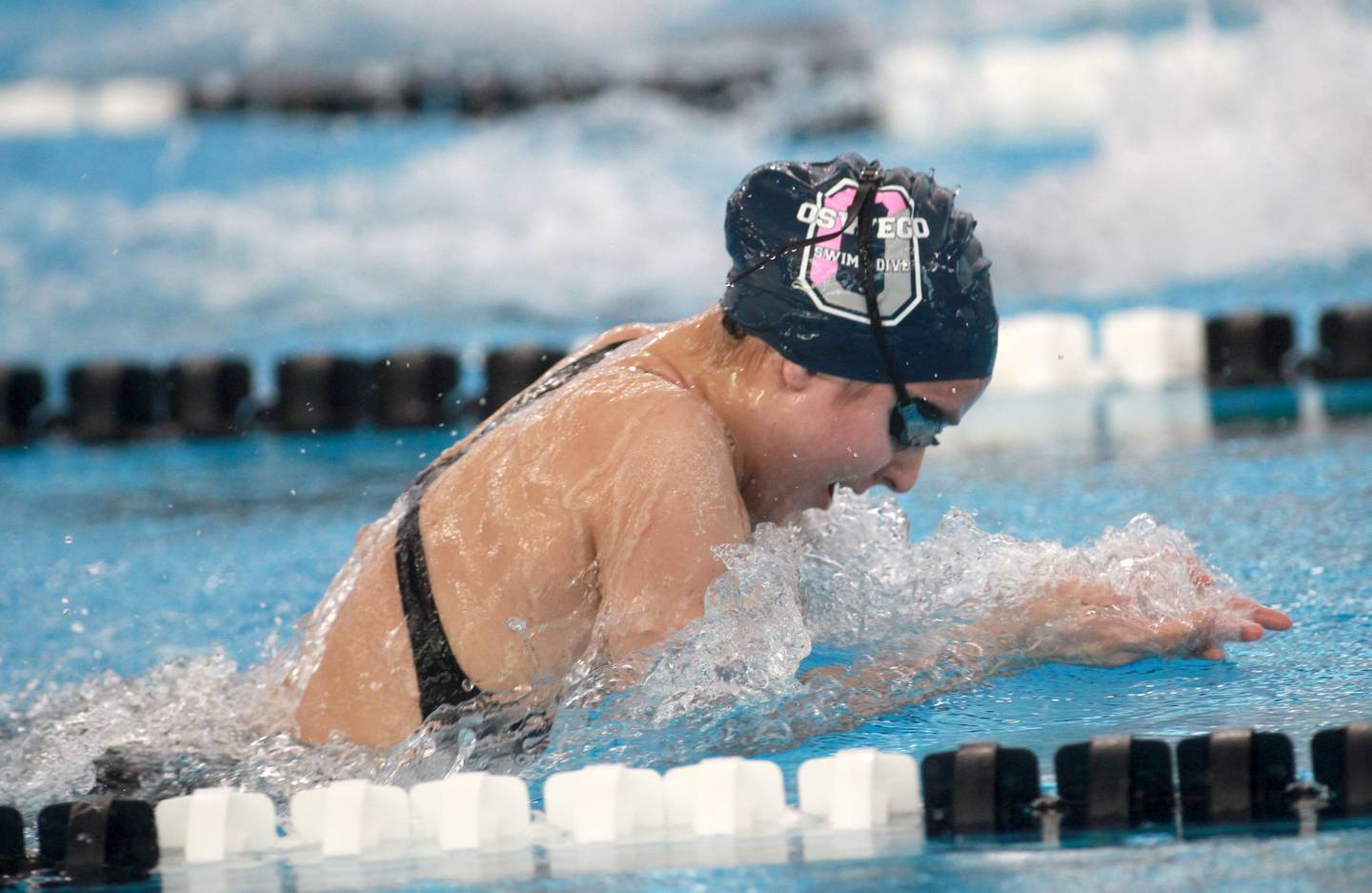 Oswego’s Chloe Diner competes in the 100-yard breaststroke championship heat during the IHSA Girls State Swimming and Diving Championships at the FMC Natatorium in Westmont on Saturday, Nov. 11, 2023.