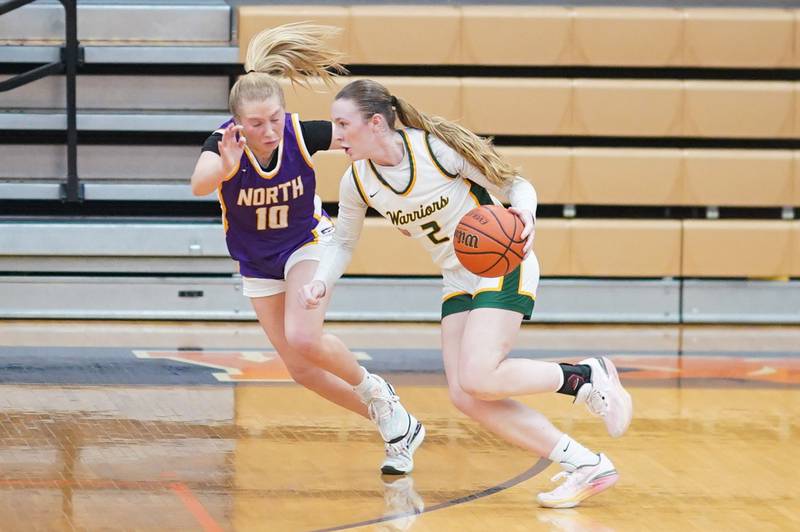 Waubonsie Valley's Hannah Laub (2) drives to the basket against Downers Grove North's Hope Sebek (10) during a Oswego semifinal sectional 4A basketball game at Oswego High School on Tuesday, Feb 20, 2024.