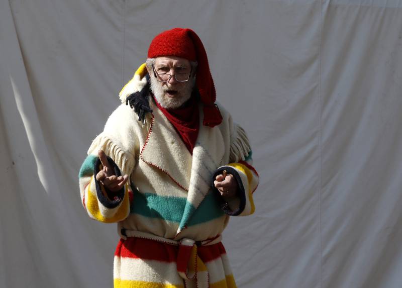 Volunteer Buck Wallace, dressed in early 1700s era clothing, talks how Native Americans discovered maple syrup while teaching about the history of maple sugaring during the McHenry County Conservation District’s annual Festival of the Sugar Maples at Coral Woods Conservation Area, 7400 Somerset Drive in Marengo. People were able to walk through the woods and learn about history of maple sugaring and the evolution of the sap collection process during the one-hour, half-mile hike through a woodland trail on Monday, March 6, 2023. The festival continues on March 11, 12 and 13, and signing up for a tour time slot is required.