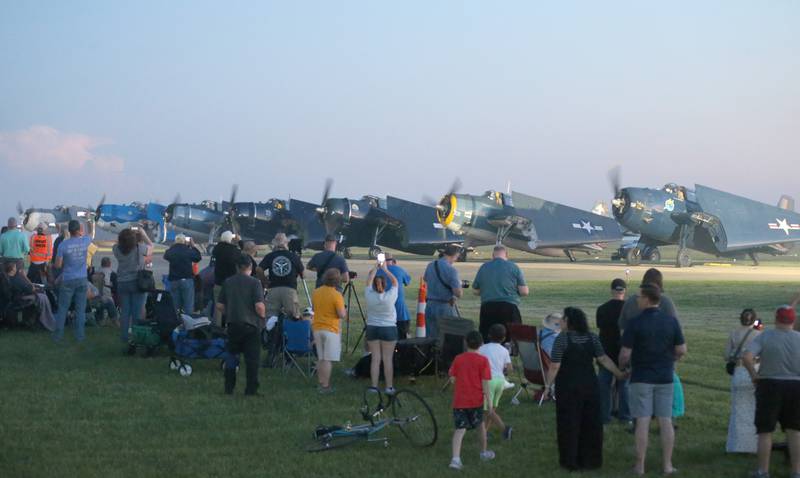 Pilots fire their engines up for the TBM Glow during the annual TBM Avenger Reunion and Air Show on Friday, May 17, 2024 at the Illinois Valley Regional Airport in Peru.