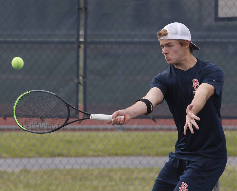 Buffalo Grove’s Justin Adrowski returns the ball during an IHSA 2A boys doubles tennis match Thursday, May 25, 2023, at Buffalo Grove High School.