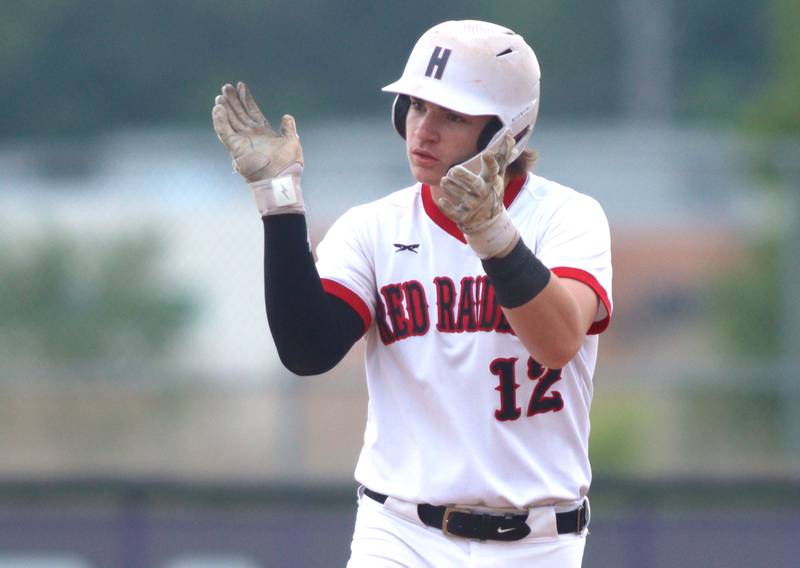 Huntley’s AJ Putty celebrates after reaching on a single against McHenry in sectional final baseball action at Hampshire Saturday. The game was suspended due to weather.