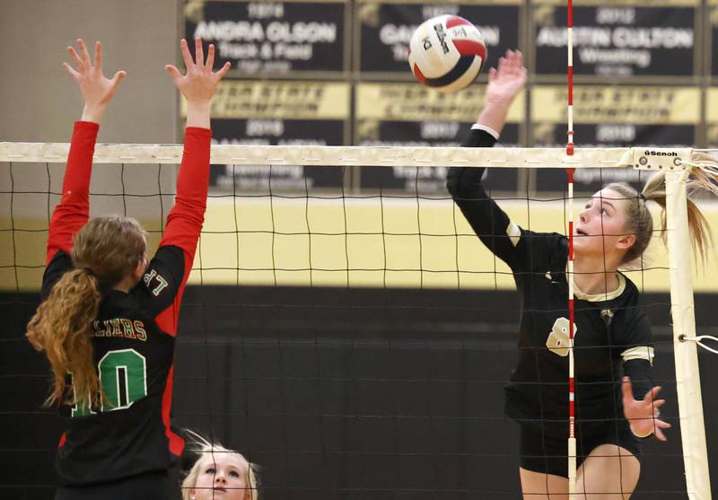 Sycamore's Ava Carpenter tries to hit the ball by LaSalle-Peru's Katie Sowers during their match Tuesday, Oct. 10, 2023, at Sycamore High School.