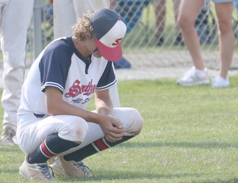 Michigan's Taylor Wisinski reacts after being defeated by Burbank during the Central Regional Baseball Tournament championship on Thursday, July 18, 2024 at J.A. Happ Field in Washington Park in Peru.