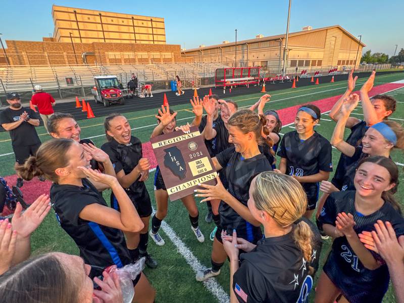 St. Charles North players celebrate after defeating Batavia to win the Class 3A Batavia Regional soccer final at Batavia High School in Batavia on Friday, May 17, 2024.