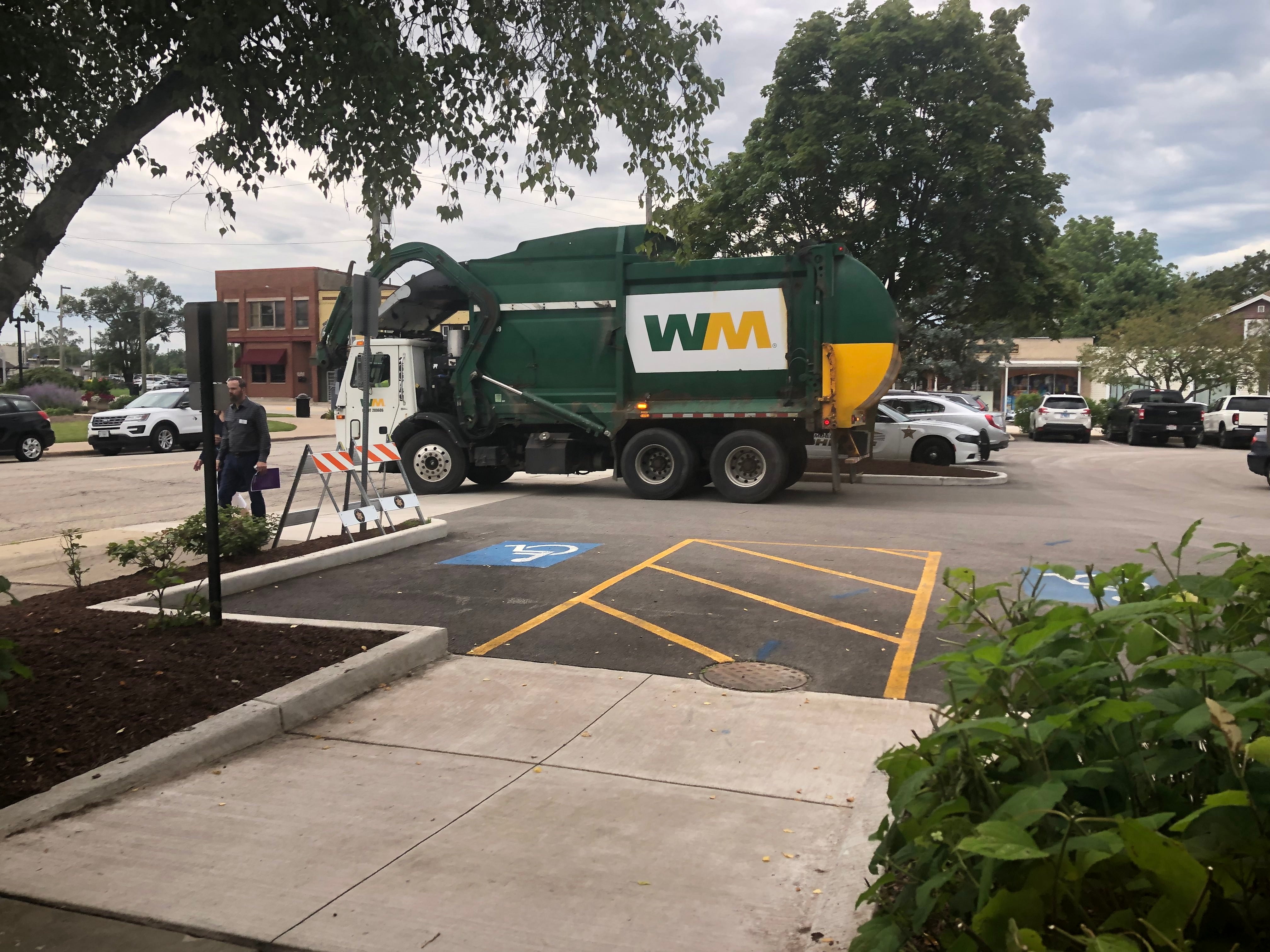 A garbage truck leaves the McHenry County College University Center parking lot in Woodstock Aug. 1, 2024.