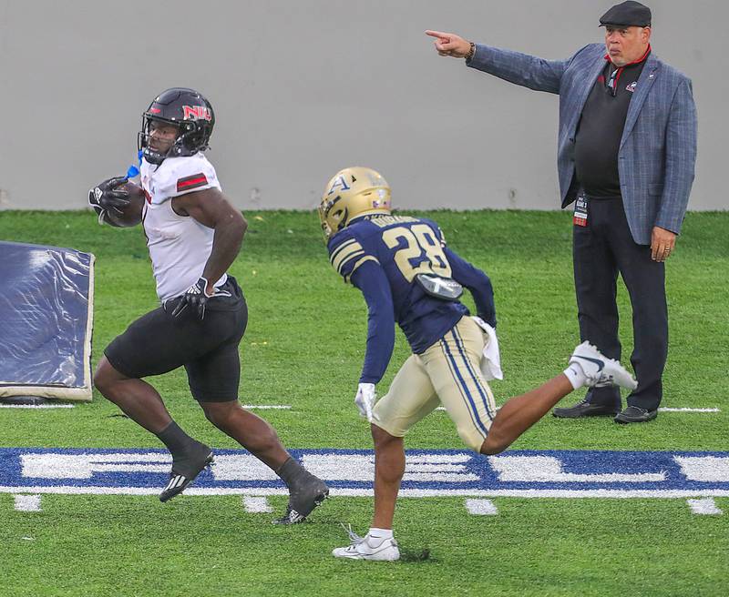 NIU running back Antario Brown gets past University of Akron defensive back Tyson Durant for a third quarter touchdown on Saturday, Oct. 7, 2023, in Akron, Ohio, at InfoCision Stadium.