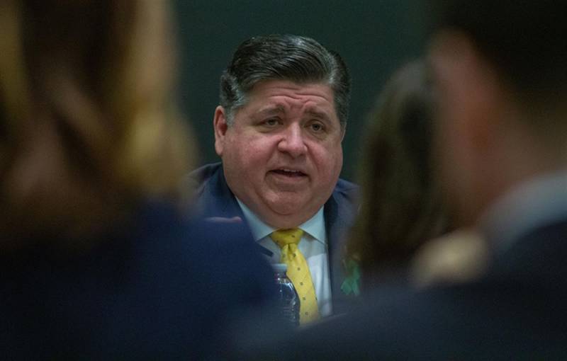 Gov. JB Pritzker speaks to an audience of professionals from the behavioral and mental health field at the Abraham Lincoln Presidential Library on May 15. He said the state needs to make mental health services more accessible