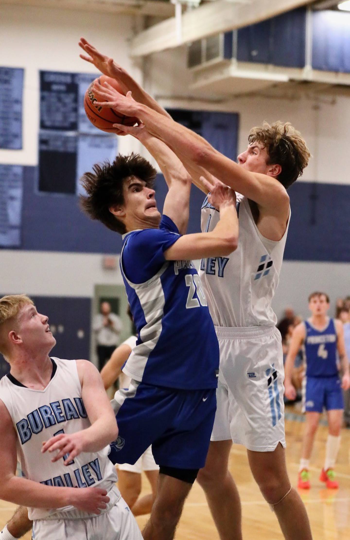 Bureau Valley's Justin Moon blocks Princeton's Liam Swearingen at the Storm Cellar Thursday night. The Storm won 62-56.