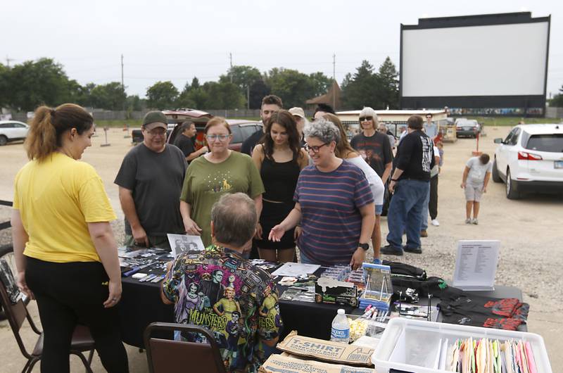 People wait to see Butch Patrick, who played Eddie Munster on the 1960s show “The Munsters” as he signs autographs, Wednesday, Aug. 14, 2024, during an appearance at the McHenry Outdoor Theater.