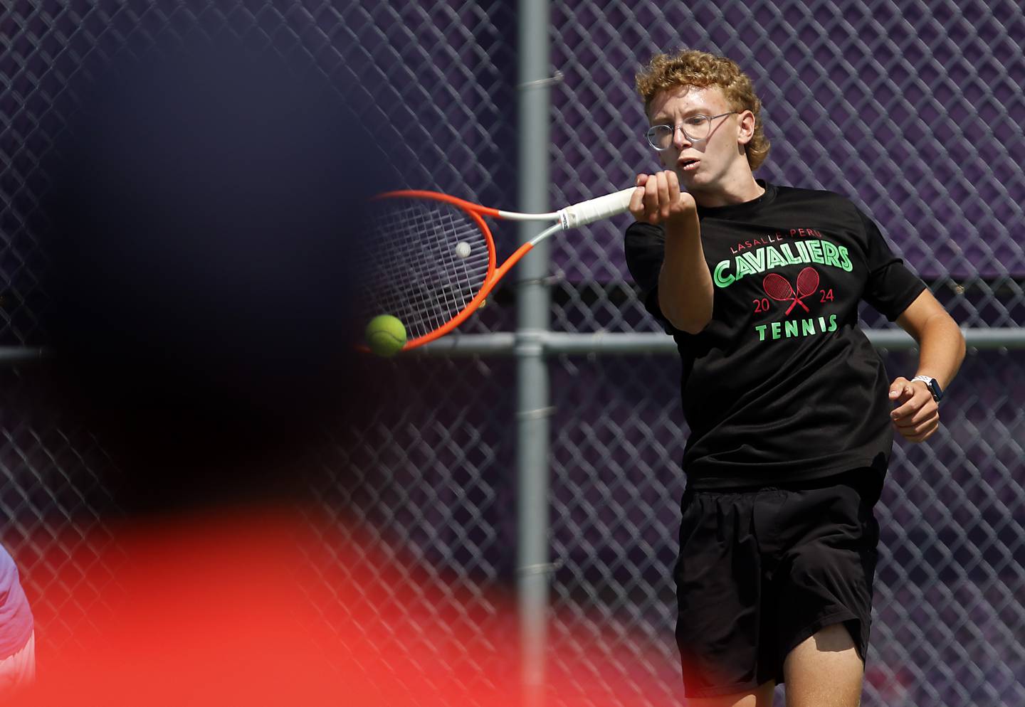 LaSalle-Peru's Andrew Bollis returns the ball as he competes in the Class 1A Boys Doubles State Tennis Tournament on Thursday, May 23, 2024, at Rolling Meadows High School in Rolling Meadows.
