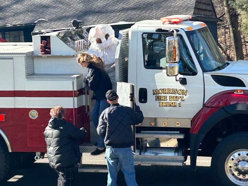 The Easter Bunny rolls up in a Morrison Fire Department firetruck Saturday during the annual Easter egg hunt in Kiwanis Park.