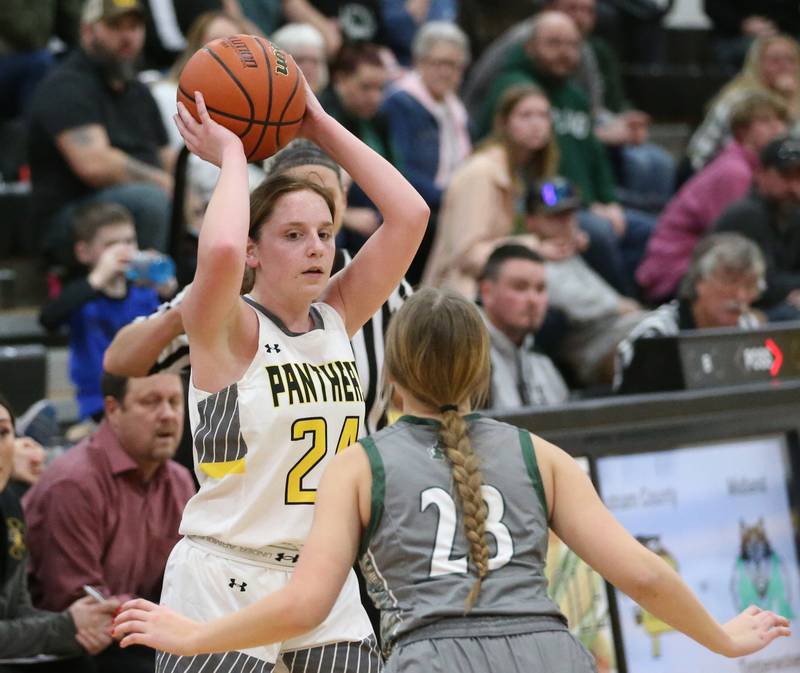 Putnam County's Gracie Ciucci looks to pass the ball around Midland's Maddie Pyles during the Class 1A Regional game on Monday, Feb. 13, 2023 at Putnam County High School.