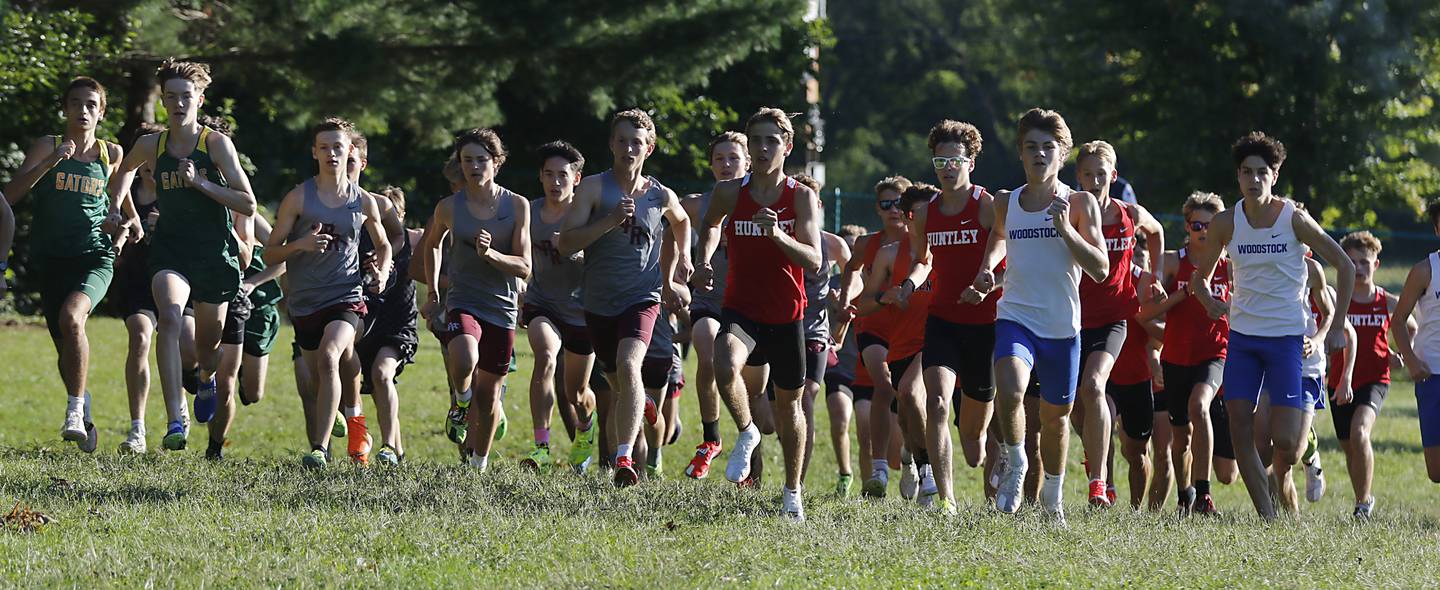 Runners compete in the boys race of the McHenry County Cross Country Invite on Saturday, August 31, 2024, at McHenry Township Park in Johnsburg.